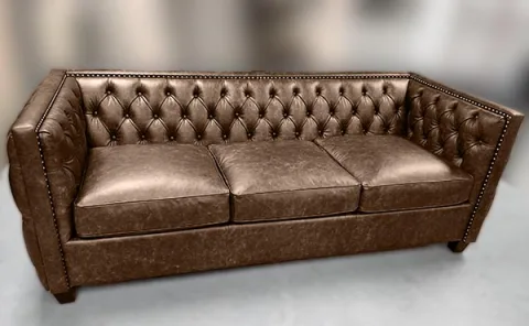 Sofa-11 — Sofa in leather, with tufted detailing and a hardwood frame
