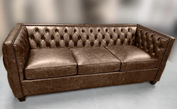 Sofa-11 — Sofa in leather, with tufted detailing and a hardwood frame