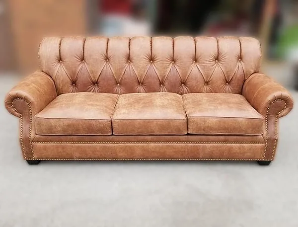 Sofa-12 — Sofa in leather, with tufted detailing and a hardwood frame