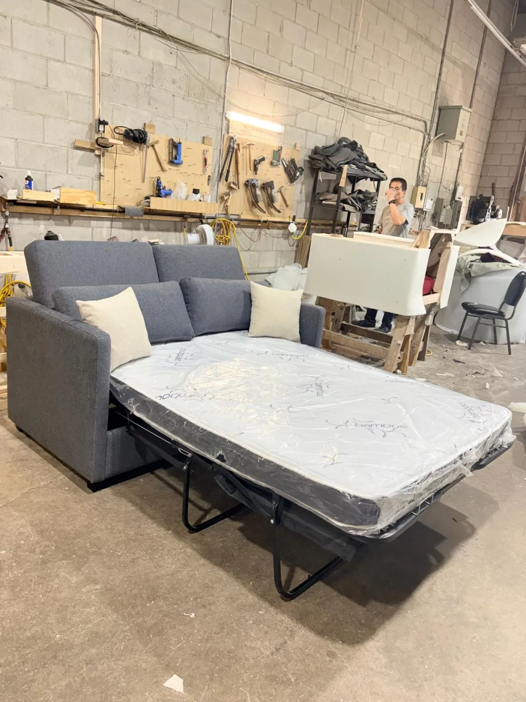 The same sofa opened out into a bed, with the mattress extended