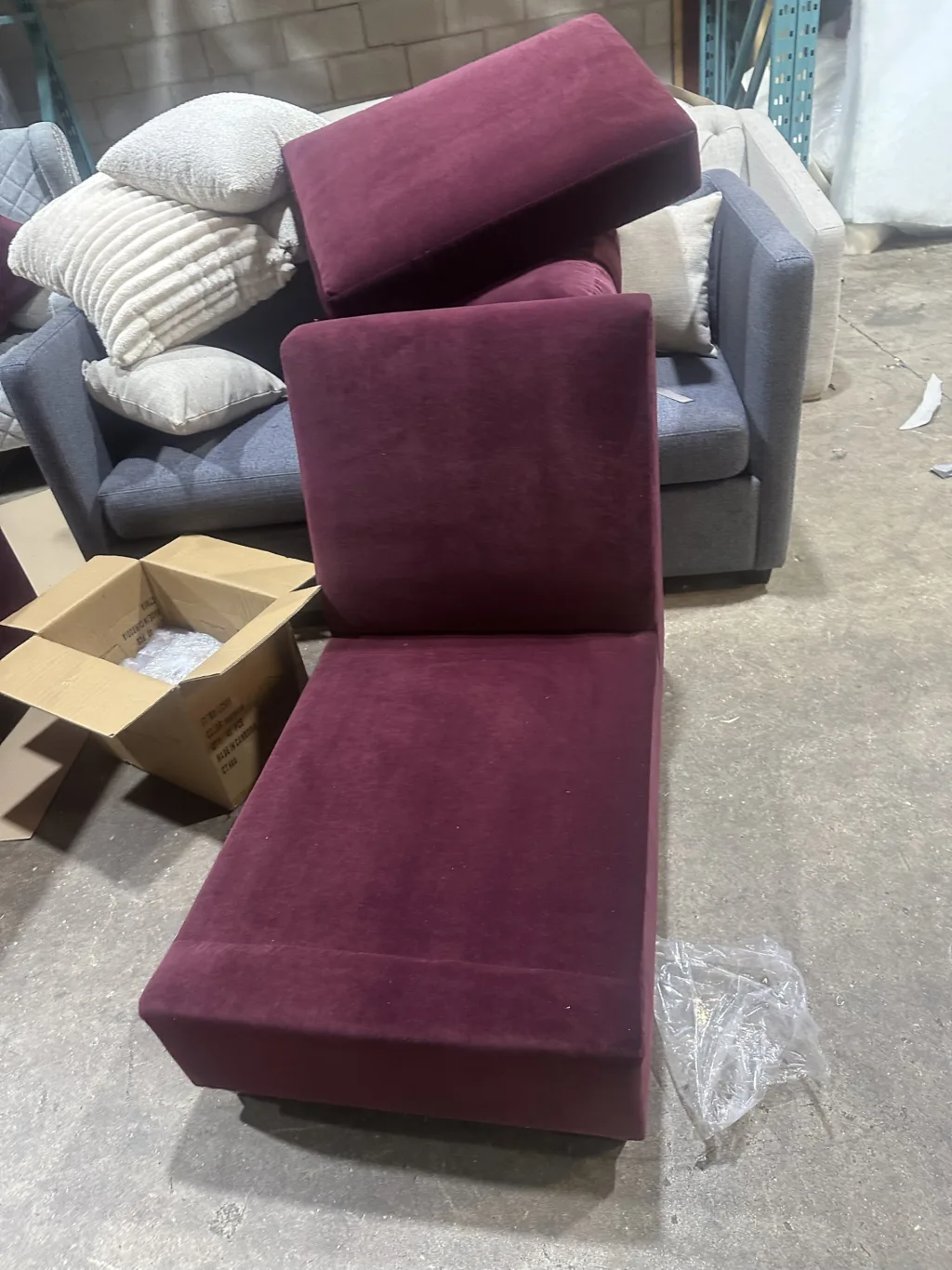 The same theatre seating in burgundy velvet, seat and back before assembly